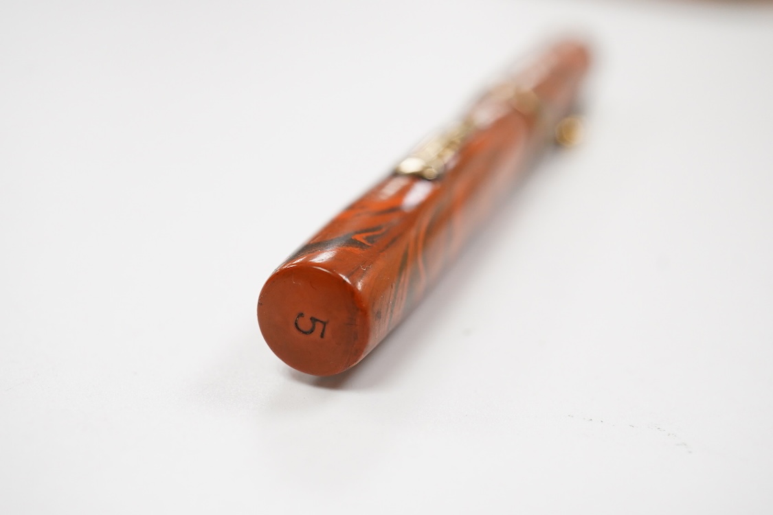 A Waterman Red Ripple No. 5 lever filler with green cap band and fitted with No. 5 Waterman nib